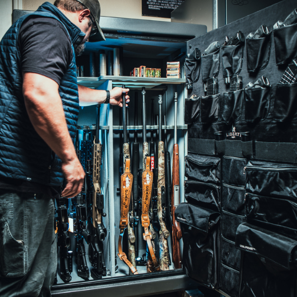 Man grabbing gun from safe